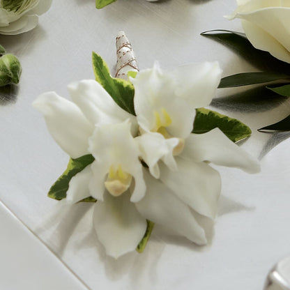 White Mini Cymbidium Boutonniere –  Nela Park Florist Llc, East Cleveland OH